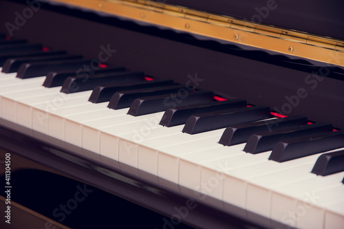 A brand new piano in the classroom. Close-up of Piano Keyboard. Piano class. Crassic musical instrument