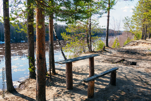Fototapeta Naklejka Na Ścianę i Meble -  bench in the forest by the river