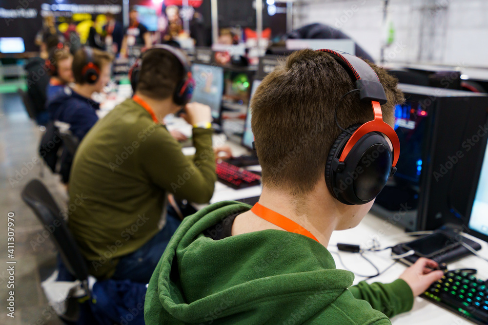 People playing video games on PC. Professional gamers People playing video games on PC. Professional gamers