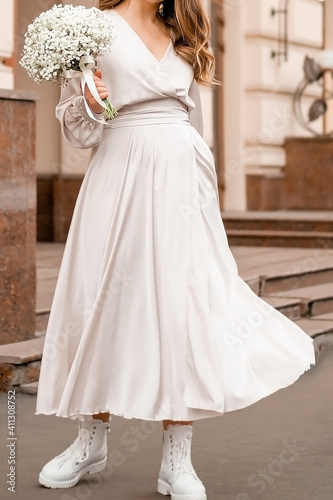 girl holding a bouquet of white gypsophila, bridal wedding bouquet.