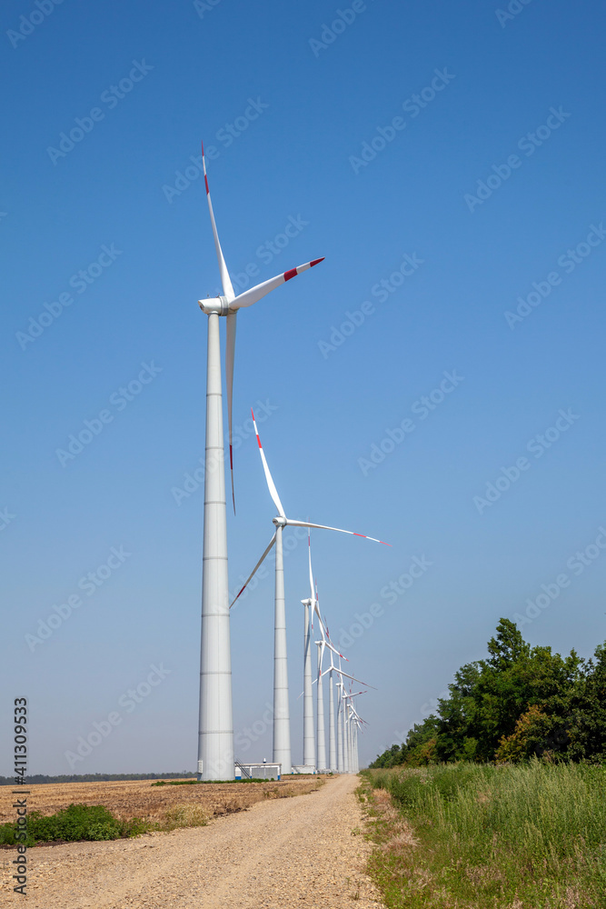 wind turbines on cloudy blue sky background wind turbines on cloudy blue sky background