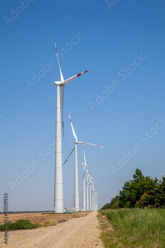 wind turbines on cloudy blue sky background