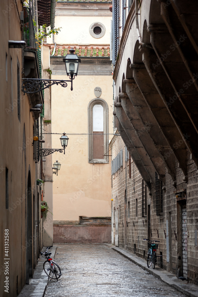 A view of the city, in the historic centre of Florence, Italy. Santo Spirito church in the background.