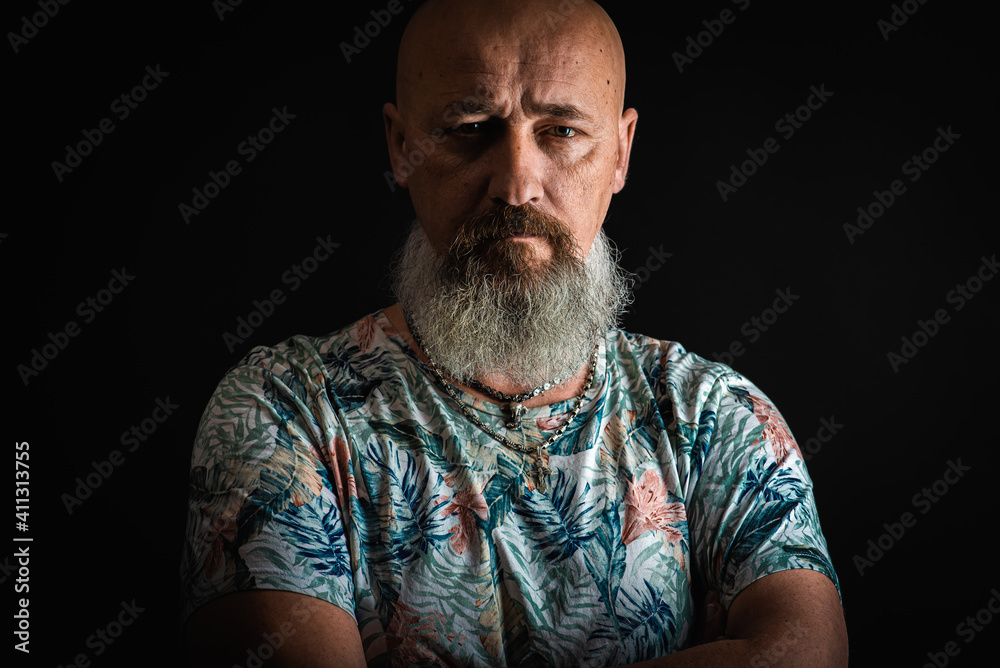 close up, portrait of emotional, thoughtful, handsome positive young bearded businessman man. Low key isolated on dark background. Body language close up, portrait of emotional, thoughtful, handsome positive young bearded businessman man. Low key isolated on dark background. Body language