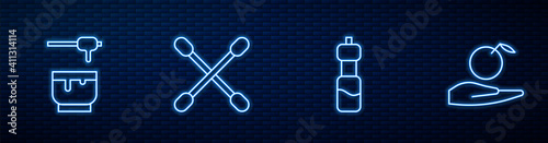 Set line Bottle of water, Honey dipper stick and bowl, Cotton swab for ears and Apple in hand. Glowing neon icon on brick wall. Vector.