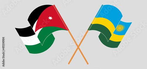 Crossed and waving flags of Jordan and Rwanda