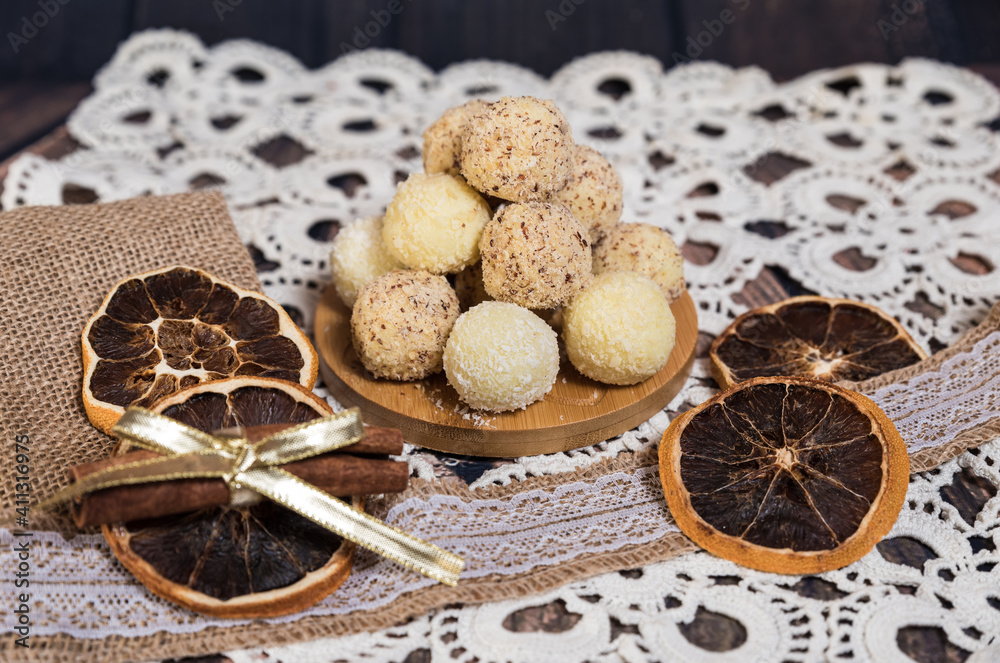 handmade vanilla balls wrapped in coconut, walnut and almond sprinkles, nicely decorated with dried oranges. handmade vanilla balls wrapped in coconut, walnut and almond sprinkles, nicely decorated with dried oranges.