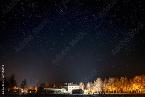 Starry night sky over the school