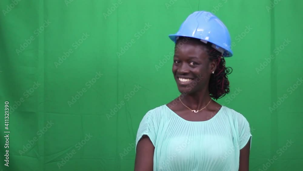 businesswoman engineer showing her thumb up smiling.