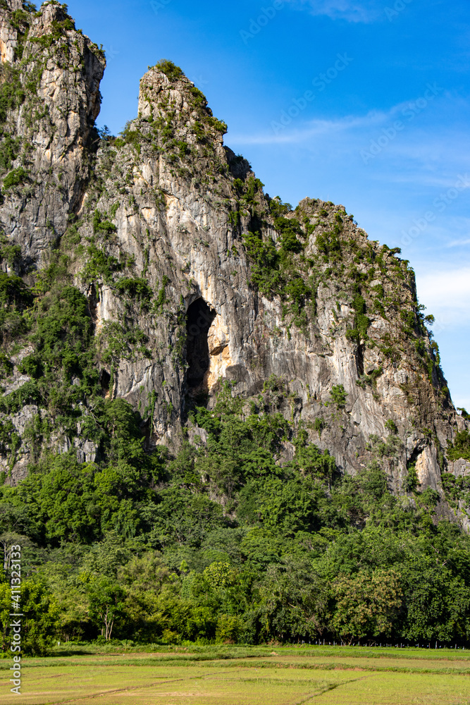 The view of rocky mountains with blue sky, Khao I Bit (Khao Yoi), Thailand. The view of rocky mountains with blue sky, Khao I Bit (Khao Yoi), Thailand.