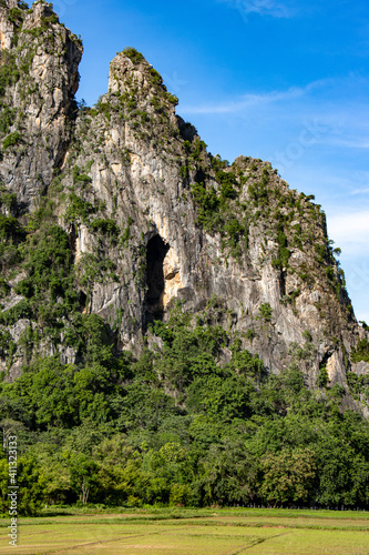 The view of rocky mountains with blue sky, Khao I Bit (Khao Yoi), Thailand. © milkovasa