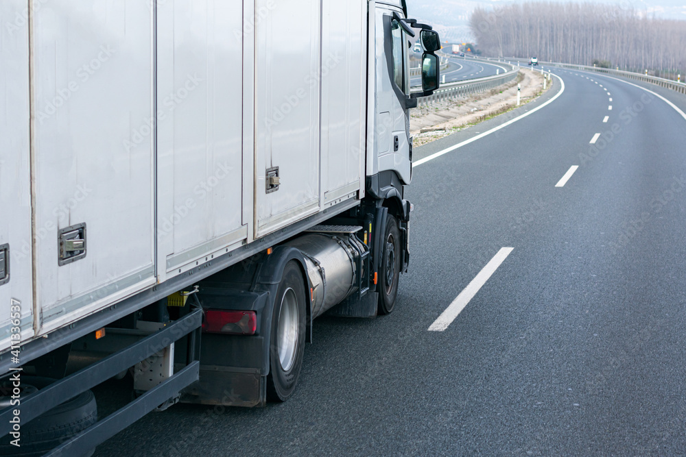 Naklejka premium Ecological truck driving on the highway with a gas tank as fuel