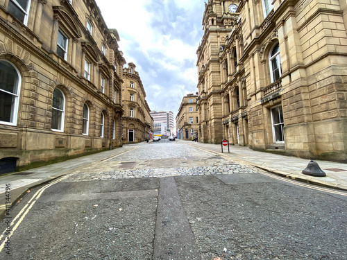 View along, Crossley Street, with fine Victorian stone buildings, in the centre of, Halifax, Yorkshire, UK