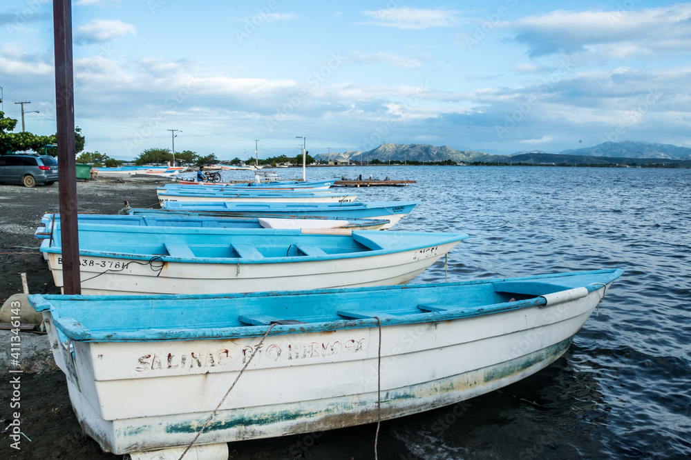 Dramatic image of fishing boats lined up on the Caribbean coast ready for fishing, in the Dominican Republic. Dramatic image of fishing boats lined up on the Caribbean coast ready for fishing, in the Dominican Republic.