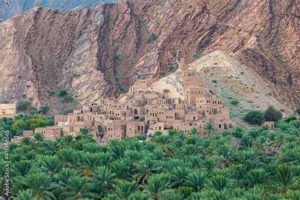 Palm trees and a traditional mountain village in Nizwa,Oman.
