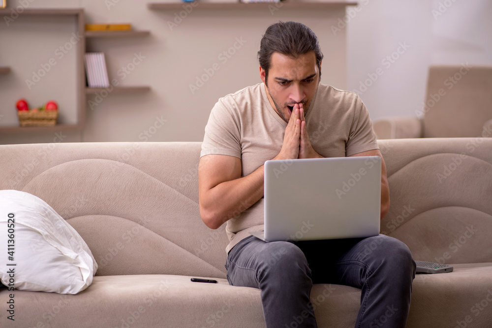 Young male freelancer working at home Young male freelancer working at home
