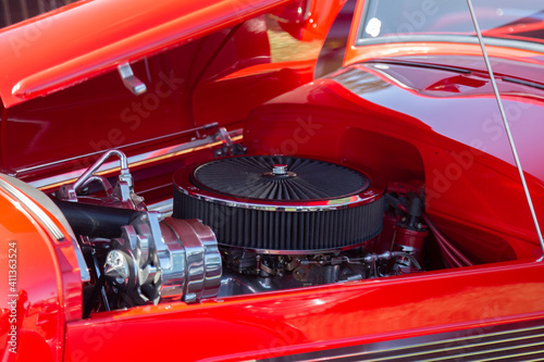 An Under the Hood Side View of Restored Vintage Automobile Engine with Show-Chrome Air Filter