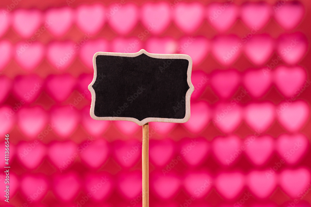 Little black chalkboard and pink and red hearts background. Valentine's Day decoration Little black chalkboard and pink and red hearts background. Valentine's Day decoration