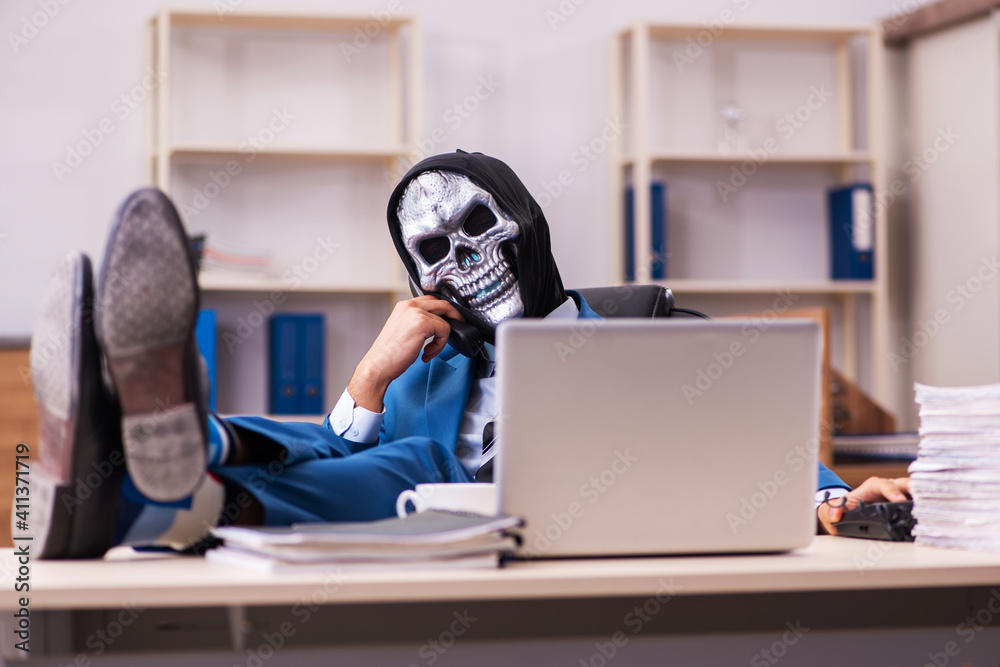 Devil businessman working in the office Devil businessman working in the office