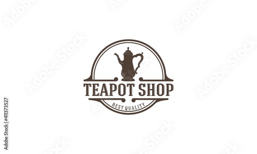 a logo suitable for a shop selling tea complete with leaves and a teapot