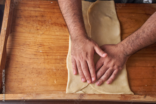 cook kneads his preparation before baking