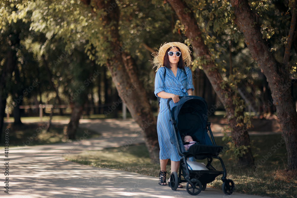Happy Mother Walking Baby Outdoors in Stroller Happy Mother Walking Baby Outdoors in Stroller