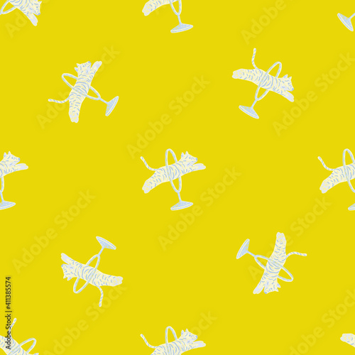 Bright abstract animal seamless pattern with circus tiger white silhouettes. Bright yellow background.
