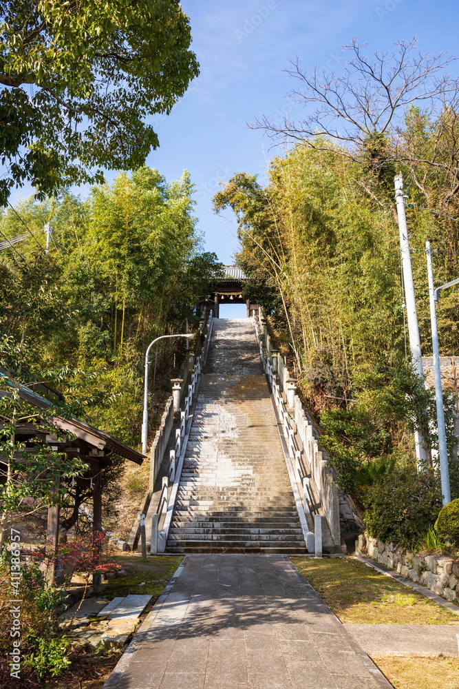 Japanese shrine , long stone stairs to temple gate , Shikoku, Japan