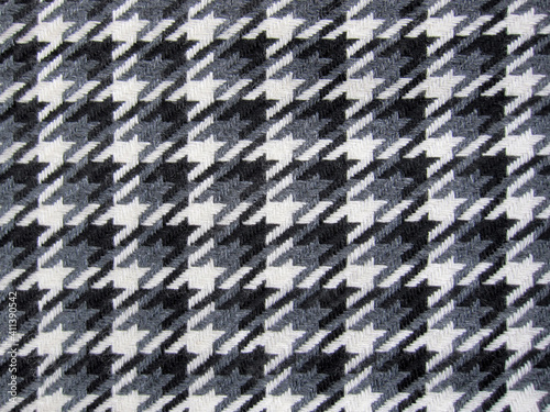 Tweed fabric houndstooth texture, wool pattern close up, woven textile background