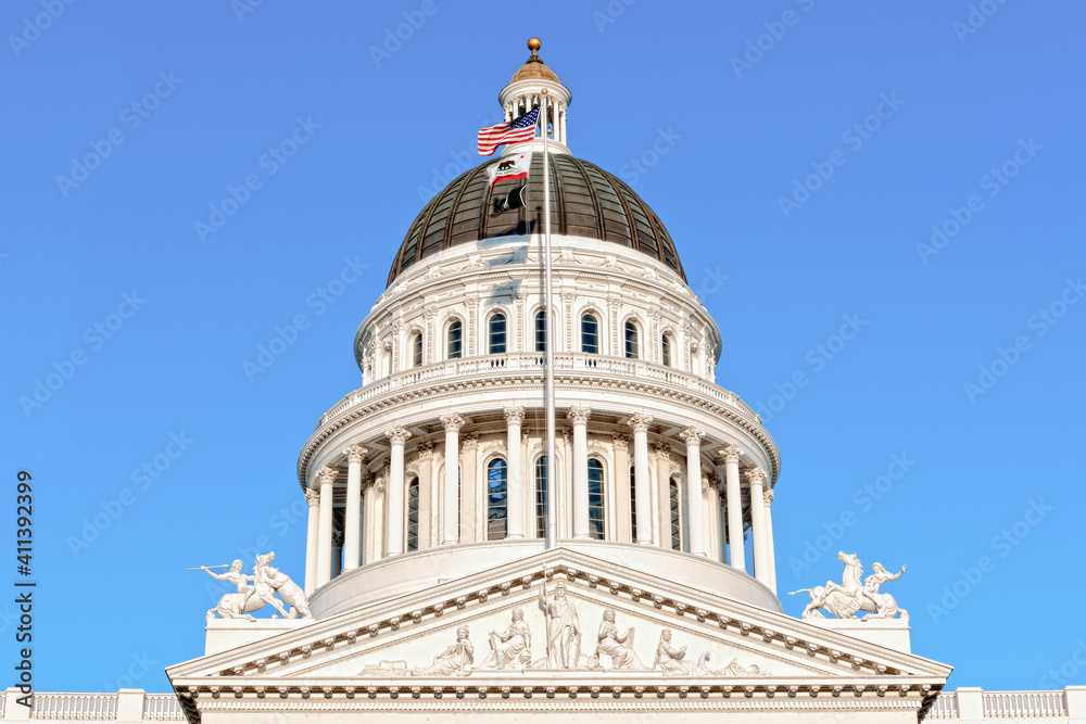 California Capitol Dome in Sacramento set against a blue sky.