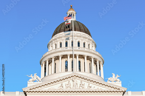 California Capitol Dome in Sacramento set against a blue sky.