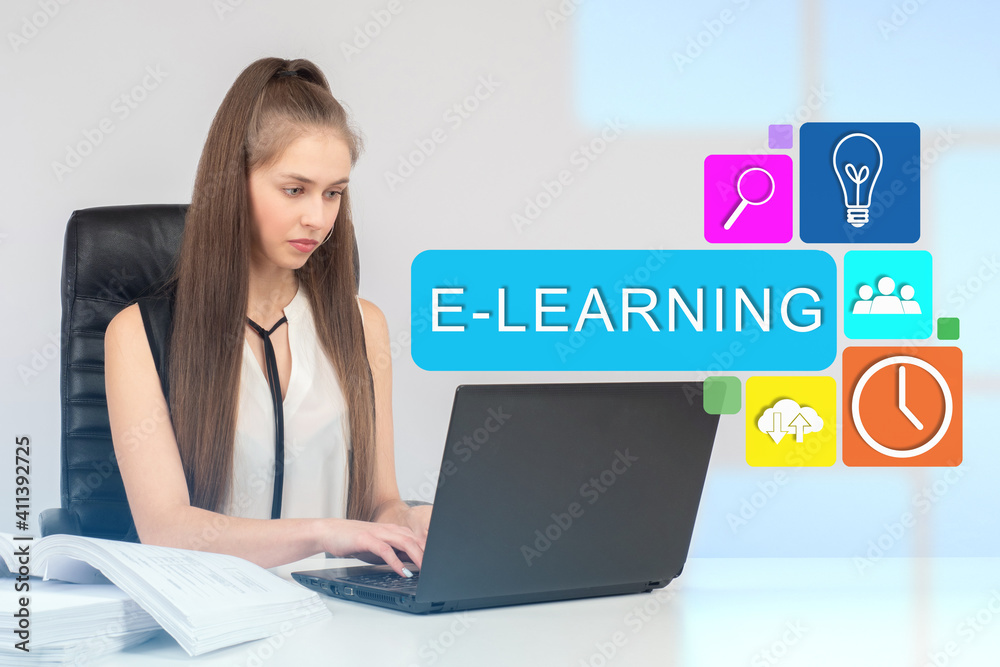 Online university student. Concept she studies business over the internet. E-learning inscription as a symbol of distance learning. E-learning business girl. Electronic training business management Online university student. Concept she studies business over the internet. E-learning inscription as a symbol of distance learning. E-learning business girl. Electronic training business management
