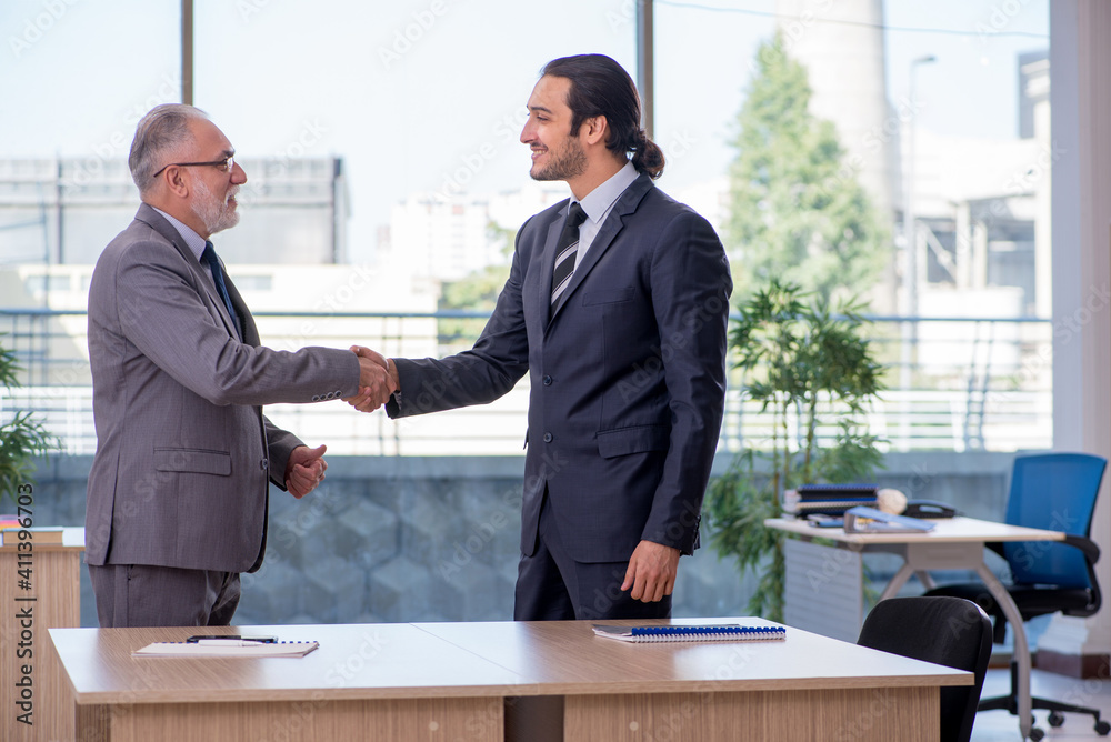 Two businessmen discussing business project Two businessmen discussing business project