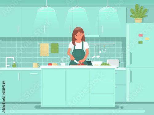 Cute woman preparing salad in the kitchen. Cooking meals for breakfast or lunch. Healthy eating