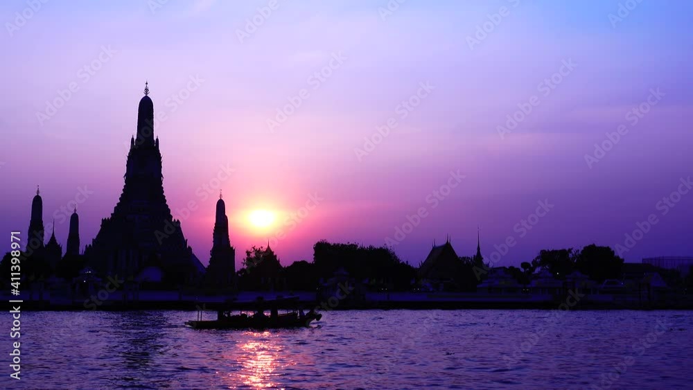 4K Temple of Dawn or Wat Arun with Chao Phraya River, Bangkok Thailand in Rattanakosin Island in architecture, Urban old town city skyline. downtown area at sunset