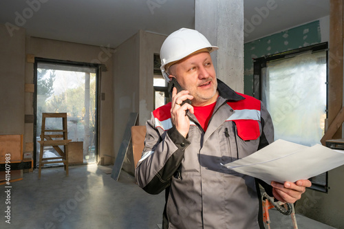 Smiling bearded worker with...