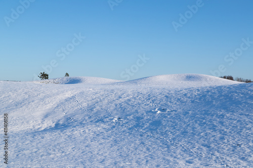 Rolling snowy landscape with animal tracks in the snow. Shot in Gothenburg, Sweden 020621 © Andreas Bergerstedt