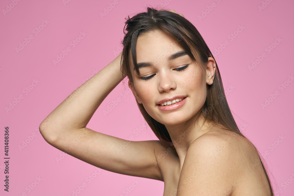 brunette bare shoulders clear skin body care pink background brunette bare shoulders clear skin body care pink background