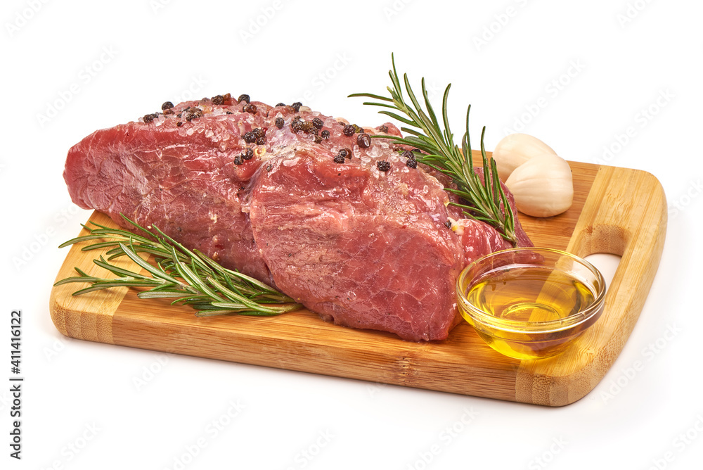 Raw veal meat with spices and oil, prepared for cooking, isolated on white background Raw veal meat with spices and oil, prepared for cooking, isolated on white background