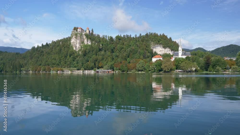 Scenic landscape of lake Bled with view to the Castle of Bled and Church of Saint Martin at summer day. Scenic landscape of lake Bled with view to the Castle of Bled and Church of Saint Martin at summer day.