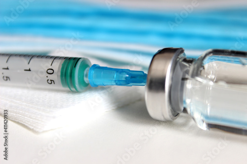 Vaccination against the new Corona Virus SARS-CoV-2: A syringe being drawn up with SARS-CoV-2 vaccination