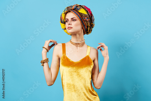 pretty woman ethnicity jewelry turban yellow dress posing