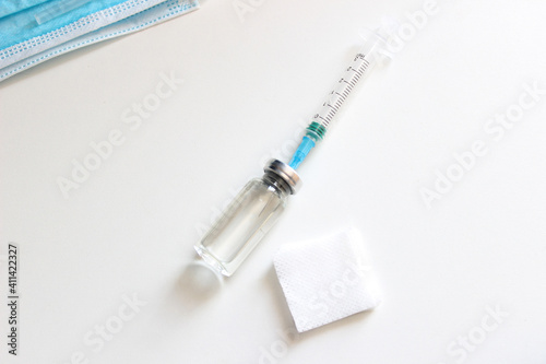 Vaccination against the new Corona Virus SARS-CoV-2: A syringe being drawn up with SARS-CoV-2 vaccination