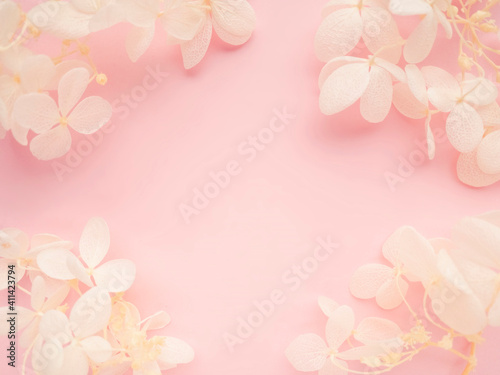 Flowers composition. Frame made of white flowers hydrangea on pink background. Valentines day, mothers day and womens day concept. Flat lay, top view.