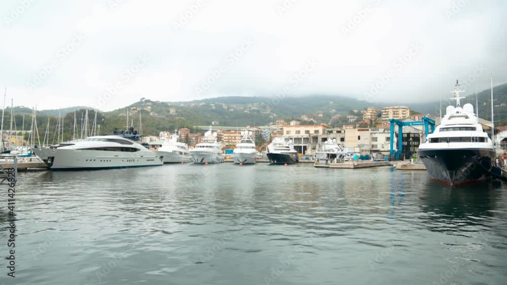 Big yachts in the marina, harbor,cloudy day, Varazze ,Ligurian sea ,Italy Big yachts in the marina, harbor,cloudy day, Varazze ,Ligurian sea ,Italy