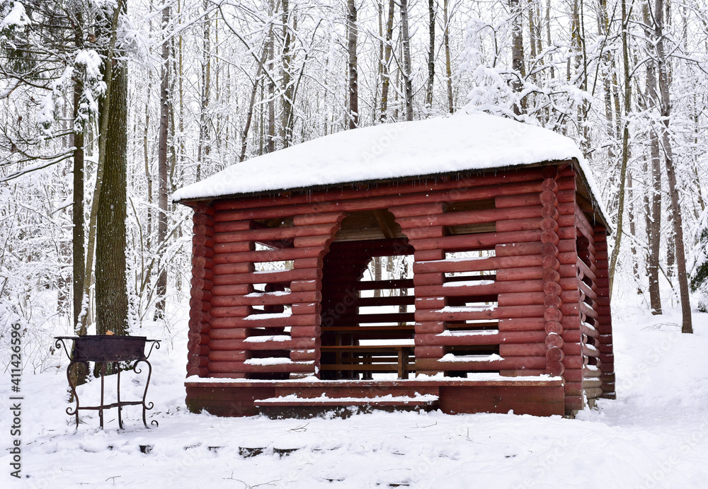 Wooden gazebo for relaxation and barbecue. Log cabin in forest for camping and weekend. Wooden Garden Gazebos for meal or relaxing with family and friends. Square wooden home with timber roof Wooden gazebo for relaxation and barbecue. Log cabin in forest for camping and weekend. Wooden Garden Gazebos for meal or relaxing with family and friends. Square wooden home with timber roof