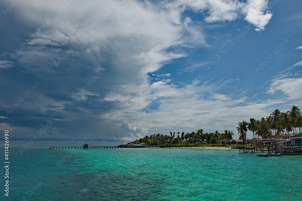 Malaysia. Coconut palms at numerous reef Islands near the island of Borneo near the town of Semporna