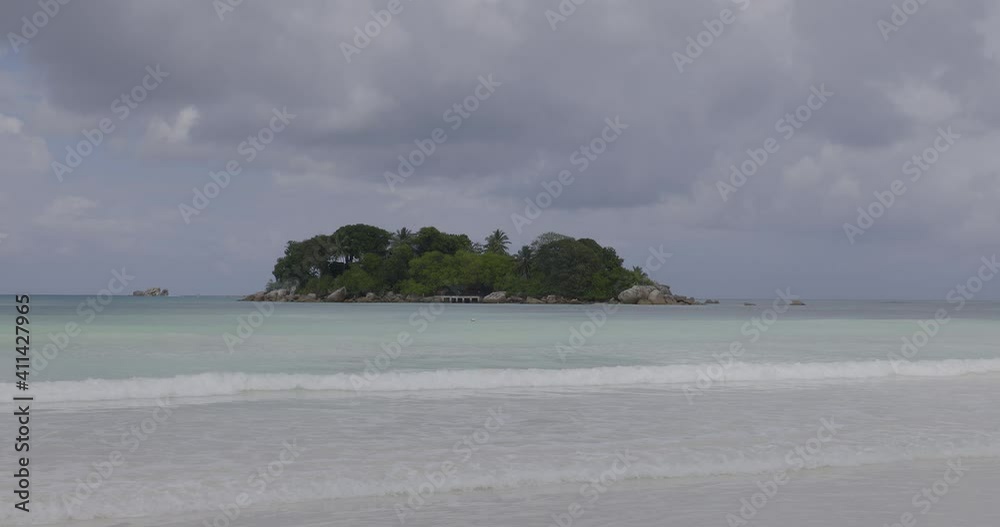 View of Chauve Souris Relais island from Cote D'or beach on Praslin Island, Seychelles
