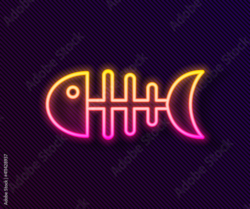 Glowing neon line Fish skeleton icon isolated on black background. Fish bone sign. Vector.