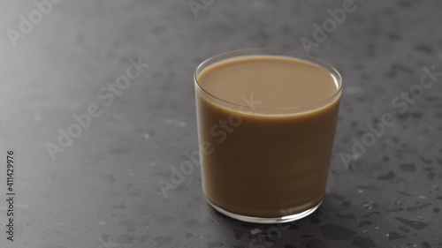 milk coffee in glass on concrete countertop